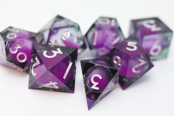 Sharp Edge Glow in the Dark Liquid Core RPG Dice Set - Violet Glimmer Plastic Dice Foam Brain Games