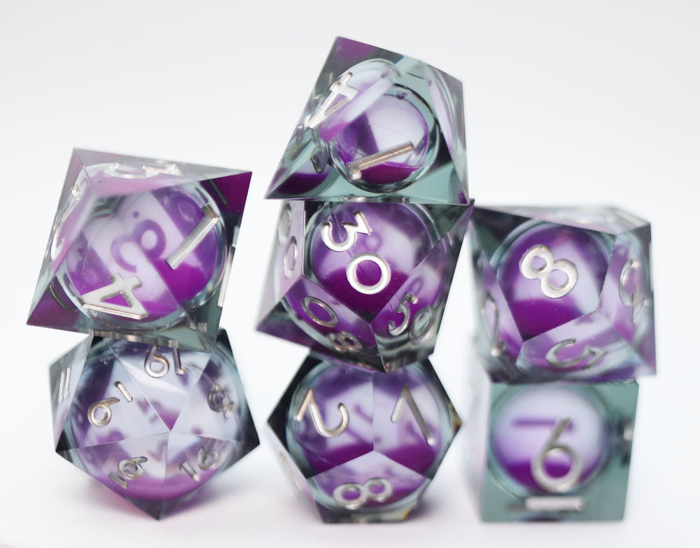 Sharp Edge Glow in the Dark Liquid Core RPG Dice Set - Violet Glimmer Plastic Dice Foam Brain Games
