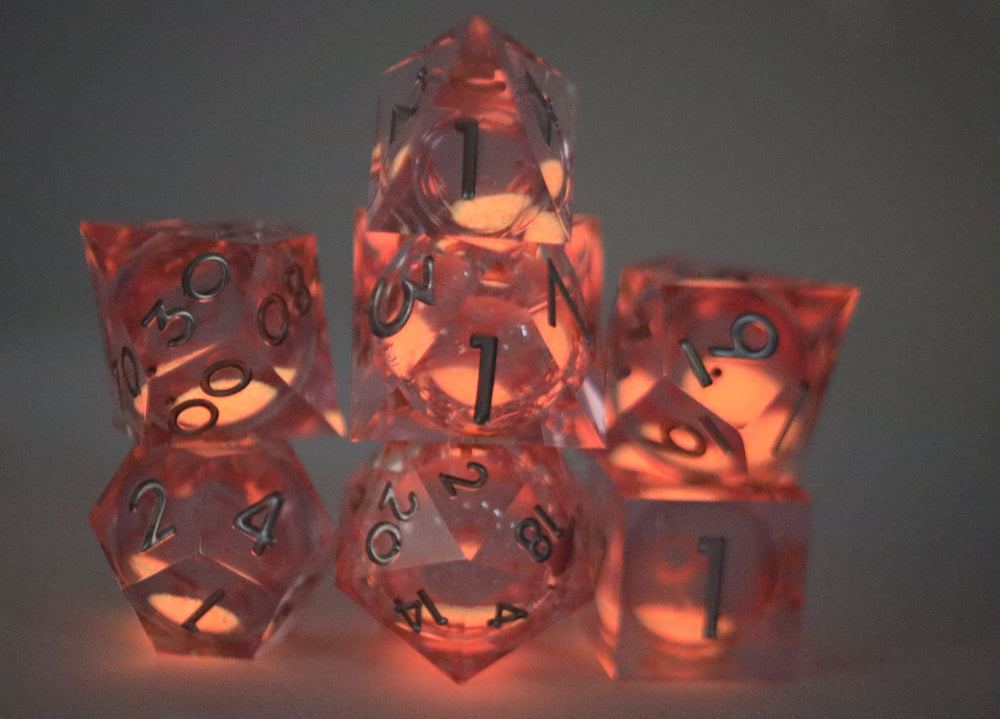 Sharp Edge Glow in the Dark Liquid Core RPG Dice Set - Radiant Pink Plastic Dice Foam Brain Games