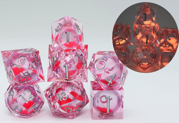 Sharp Edge Glow in the Dark Liquid Core RPG Dice Set - Radiant Pink Plastic Dice Foam Brain Games