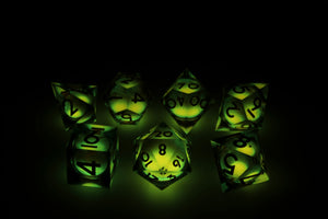 Sharp Edge Glow in the Dark Liquid Core RPG Dice Set - Topaz Glow Plastic Dice Foam Brain Games
